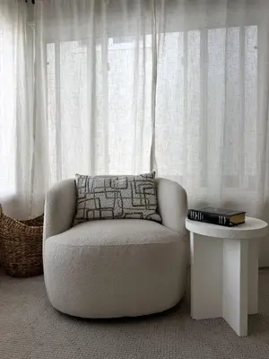 a white chair sitting in front of a window at Steps to Sand Cozy 3BR Partial Ocean Views in Manhattan Beach