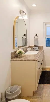 a bathroom with a sink and a mirror at Steps to Sand Cozy 3BR Partial Ocean Views in Manhattan Beach