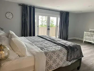 a bedroom with a bed with a crib in it at 5 Bedroom House with fabulous mountain views in Hacienda Heights