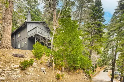 a house on a hill in the woods at 2 Mi to Lake Arrowhead Treetop Retreat with Deck in Lake Arrowhead