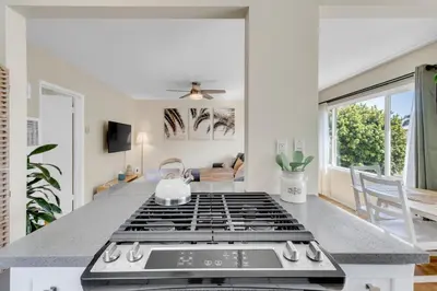 a kitchen with a stove top oven in a kitchen at Beautifully Remodeled 2bed1bath Apartment Top Location 15 min to Beach in Los Angeles