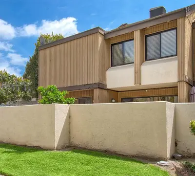 a house with a fence in front of it at Tron by Funtierland Vacation Rentals in Anaheim