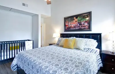 a bedroom with a bed and a picture on the wall at Tron by Funtierland Vacation Rentals in Anaheim