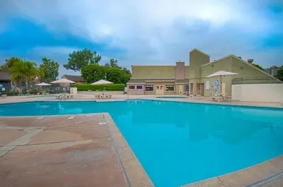 a large blue swimming pool in front of a building at New Suite Escapes 5 by Funtierland Vacation Rentals in Anaheim