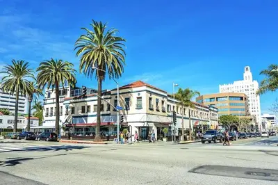 a city street with palm trees and a building at Huge Stylish Apartment Santa Mon in Los Angeles