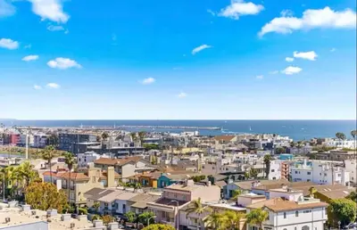 a view of a city with buildings and the ocean at Oceanfront Bliss, Beach & Marina Views, Roomy 1BR in Los Angeles