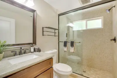 a bathroom with a toilet and a sink and a shower at Walk to Lake Arrowhead Village Gem with Lake Access in Lake Arrowhead