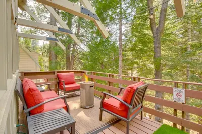 a porch with two chairs and a table and chairs at Walk to Lake Arrowhead Village Gem with Lake Access in Lake Arrowhead