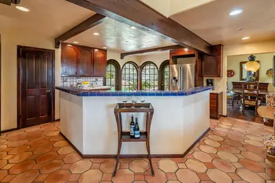 a kitchen with a center island in a house at Casa Tranquility by Paradise Retreats in Carpinteria
