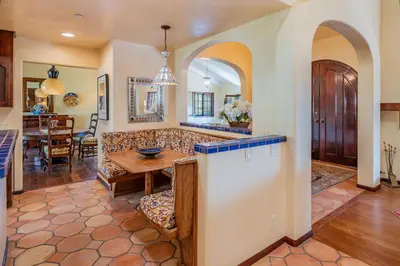 a living room with a couch and a table at Casa Tranquility by Paradise Retreats in Carpinteria
