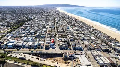 an aerial view of a beach and the ocean at Luxury Ocean View Condo Steps To The Sand VIEWS in Manhattan Beach