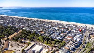 an aerial view of a beach and the ocean at Luxury Ocean View Condo Steps To The Sand VIEWS in Manhattan Beach