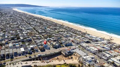 an aerial view of a beach and the ocean at Luxury Ocean View Condo Steps To The Sand VIEWS in Manhattan Beach