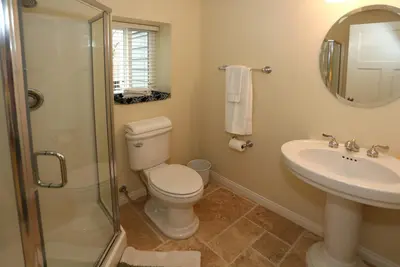 a bathroom with a toilet and a sink and a shower at Seacliff Beach House by Paradise Retreats in Ventura