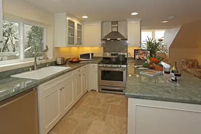 a kitchen with a sink and a stove at Seacliff Beach House by Paradise Retreats in Ventura
