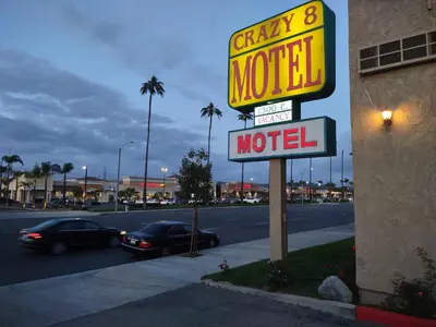 a motel sign on the side of a street at Crzy 8 Motel in Orange