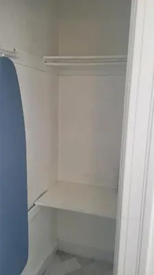 an empty closet with white shelves in a room at Amazing Hollywood Bungalow Three! in Los Angeles