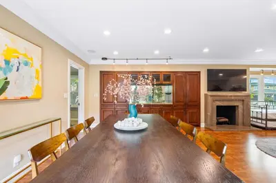 a dining room with a table and chairs and a fireplace at Beverly Hills 6BR Haven w Pool Hot Tub in Los Angeles