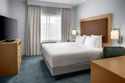 a hotel room with a bed and a flat screen tv at Homewood Suites by Hilton Anaheim Conv Ctr/Disneyland Main in Anaheim