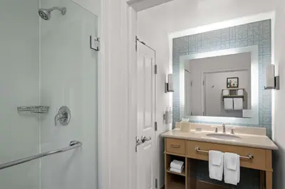 a bathroom with a sink and a shower and a mirror at Homewood Suites by Hilton Anaheim Conv Ctr/Disneyland Main in Anaheim