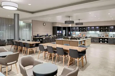 a restaurant with tables and chairs and a cafeteria at Homewood Suites by Hilton Anaheim Conv Ctr/Disneyland Main in Anaheim
