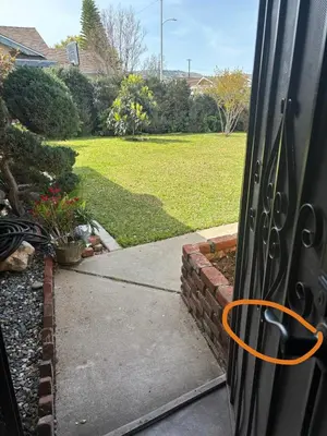a door with an orange circle on it next to a driveway at 1 bedroom In a quiet neighborhood near the Main Street- Room A in Rowland Heights