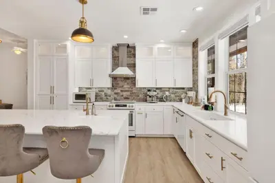 a kitchen with white cabinets and white countertops at Castlewood Retreat #2524 in Big Bear Lake