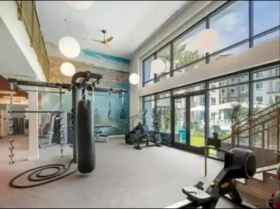 a fitness room with a gym with exercise equipment at Cozy 2 Bedroom Apartment Near Disneyland and Anaheim Convention Center in Orange