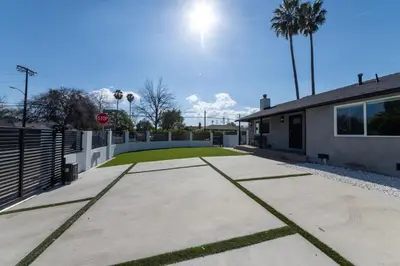 a driveway in front of a house with a stop sign at Gated Private Home next to Universal Studios in Van Nuys County Court Heliport
