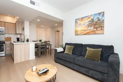 a living room with a couch and a table at Walk to Santa Monica Beach, Pier, Boardwalk and Venice in Los Angeles