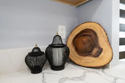 three black and white vases sitting on a counter at Spacious 3 Bedroom 2 Bathroom Apartment with Free Onsite Parking in Los Angeles