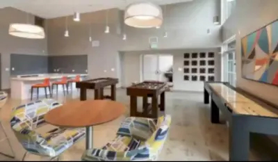 a living room with a ping pong table and chairs at Downtown Los Angeles Gem 2 in Los Angeles