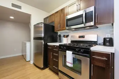 a kitchen with a stove and a refrigerator at Downtown Los Angeles Gem 2 in Los Angeles