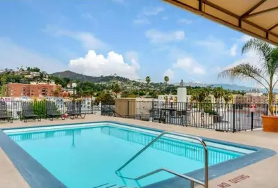 a swimming pool with a view of a city at Snazzy 2 Bedroom Pad with Rooftop Pool and Hollywood Sign View in Los Angeles