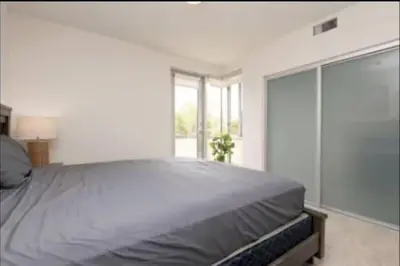 a bedroom with a large bed and a window at Hosp Walk to Santa Monica Beach Pier in Los Angeles