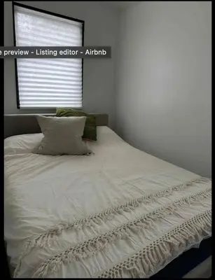 a white bed in a bedroom with a window at Venice Beach Boho - 2 apartments in Los Angeles