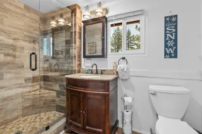 a bathroom with a shower and a toilet and a sink at StoneHauz was built in 1926! It's a REAL CABIN! in Big Bear Lake
