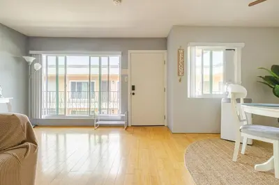 a living room with a couch and a table at Steps to Ocean Bliss in Long Beach