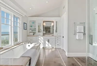 a white bathroom with a tub and a sink at Seacliff Beach Retreat - Amazing Beachfront for Family of 6 in Ventura