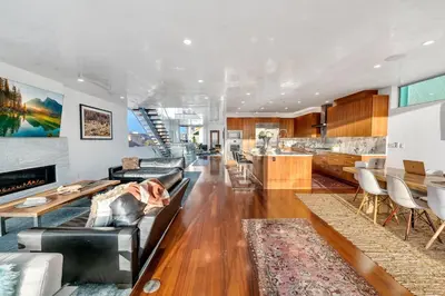 a living room with a couch and a table at Modern Ocean Front Beach Home- 3 king beds 3 bedroom in Oxnard