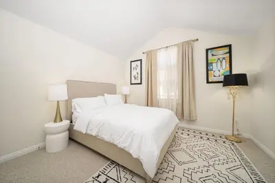 a white bedroom with a bed and a window at Modern townhouse - 4 Bedroom 3Bathroom near Pasadena, LA in Duarte