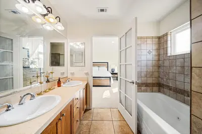 a bathroom with two sinks and a tub and a shower at Modern townhouse - 4 Bedroom 3Bathroom near Pasadena, LA in Duarte