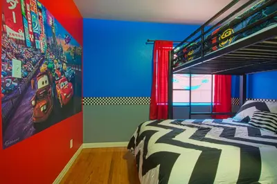 a bedroom with a captain america poster on the wall at F-13 California Dreamin in Anaheim