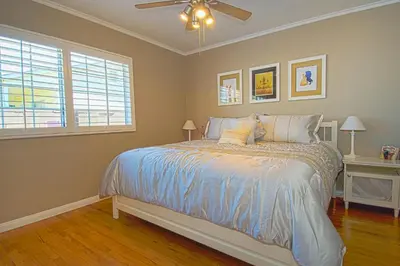 a bedroom with a bed and a ceiling fan at F-13 California Dreamin in Anaheim