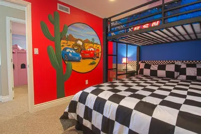 a bedroom with a bunk bed and a painting on the wall at F-16 Pirates Lair in Anaheim