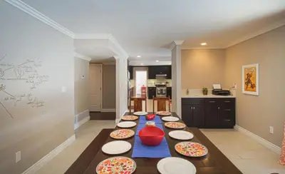 a kitchen with a long table with plates on it at F-16 Pirates Lair in Anaheim