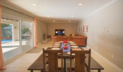 a room with a table and a living room at F-16 Pirates Lair in Anaheim