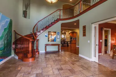 a hallway with a spiral staircase in a home at F-25 Belles Castle in Anaheim