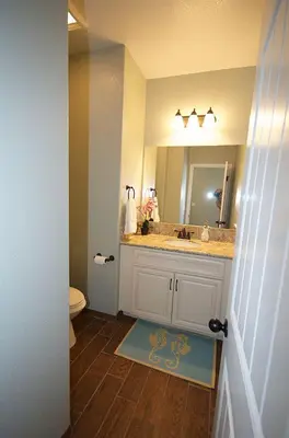 a bathroom with a sink and a mirror at F-31 Mickeys Beach House in Anaheim