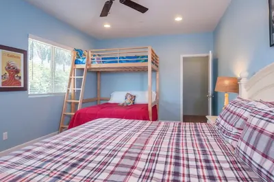 a bedroom with a bunk bed and a ladder at F-32 La Casa de Mickey in Anaheim